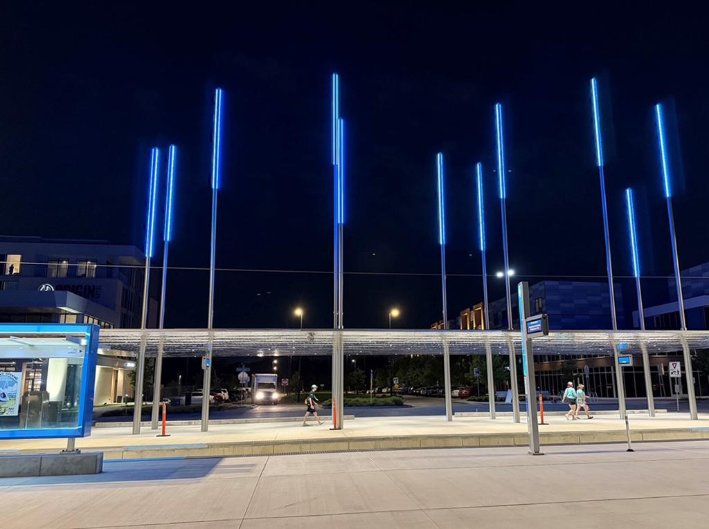 Wide view of the completed streetcar pavilion structure at dusk